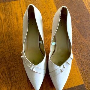 Soft pink high heeled shoes with ruffle detail